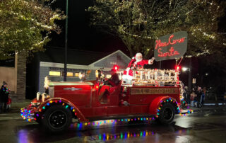 santa at light parade waving